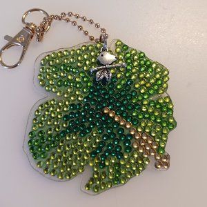 Flower keychain bird on a limb